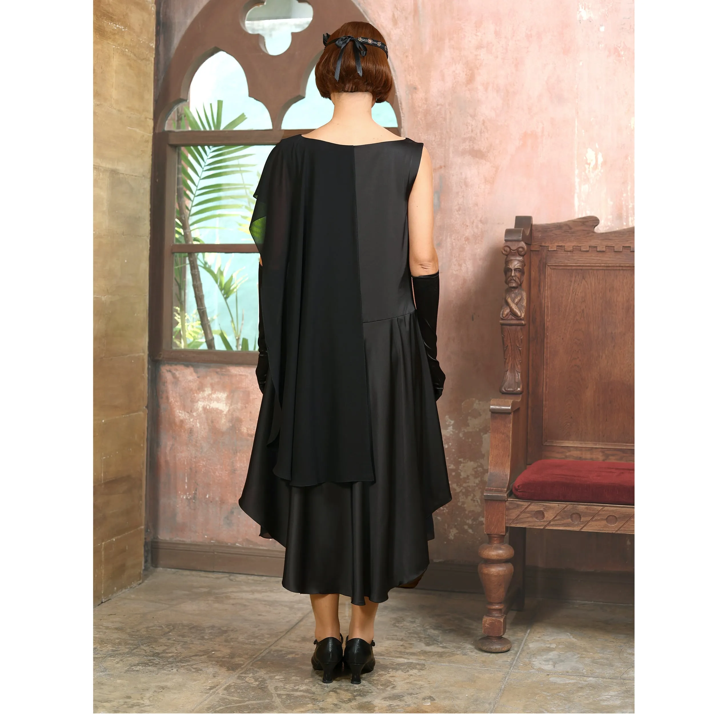 Black 1920s formal evening satin dress with a shoulder train